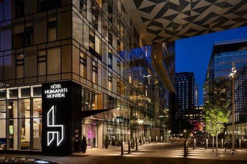 a building with a sign on the side of it at Humaniti Hotel Montreal, Autograph Collection in Montréal