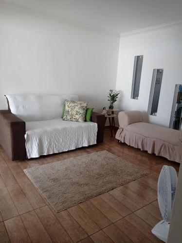 a living room with a couch and a table at Casa aconchegante - Morada do Sol in Piranhas