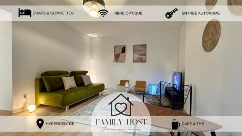 a living room with a green couch and a glass table at Les suites de Saint-Yves in Autun