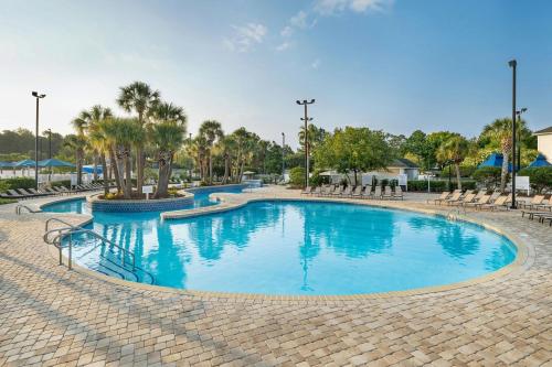 a large pool with blue water in a resort at Sheraton Broadway Resort Villas in Myrtle Beach
