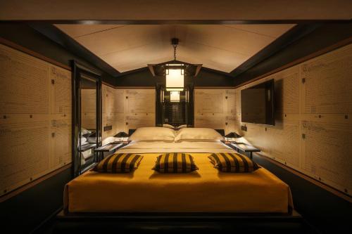 a bedroom with a large bed and a window at Duxton Reserve Singapore, Autograph Collection in Singapore