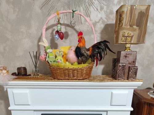 a basket with a chicken in it on a table at Zeleni raj in Hreljin Ogulinski