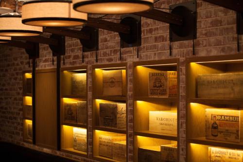 a wall of wine boxes with lights on it at The Mayflower Hotel, Autograph Collection in Washington
