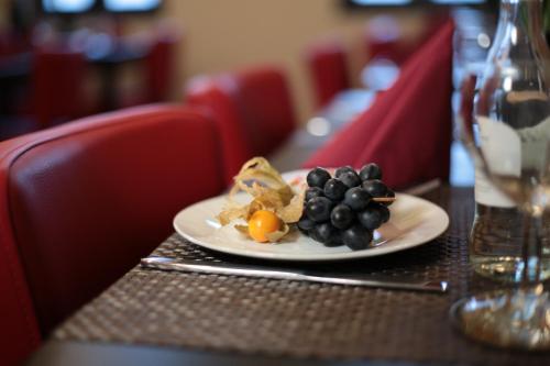 a plate of food sitting on a table at Amical Hotel Hagen - Am Hauptbahnhof in Hagen