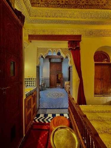 Ένα ή περισσότερα κρεβάτια σε δωμάτιο στο Riad Tagore
