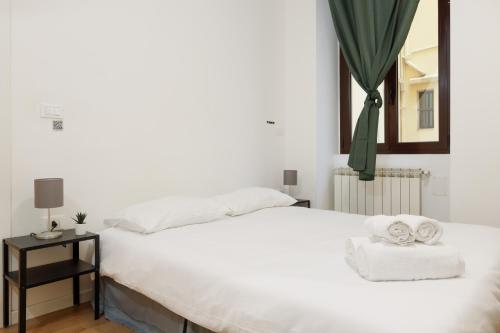 Katil atau katil-katil dalam bilik di Tra mare e città, suite Neruda a Trieste