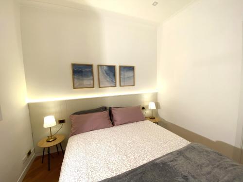 Postel nebo postele na pokoji v ubytování LovingRome Colosseum