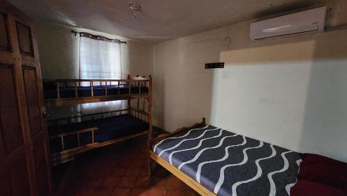 Ένα ή περισσότερα κρεβάτια σε δωμάτιο στο Casita d Playa 1