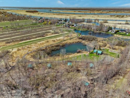 an aerial view of a farm with two ponds at Domaine de l Archipel in Sorel