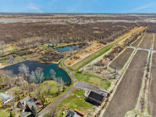an aerial view of a road and a river at Domaine de l Archipel in Sorel