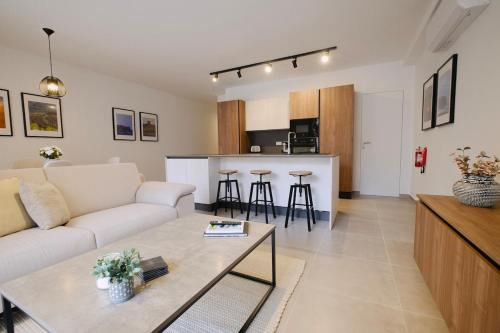 a living room with a couch and a table at Apartment in Mellieha in Mellieħa