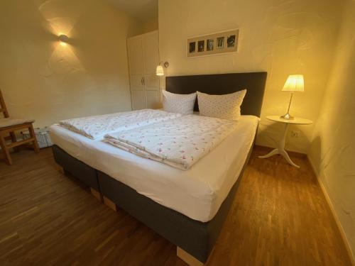 a bedroom with a large bed in a room at NaturApartments - Hideaway & Spa in Burg