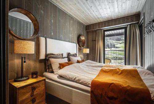 Ένα ή περισσότερα κρεβάτια σε δωμάτιο στο Cozy ski in & out apartment