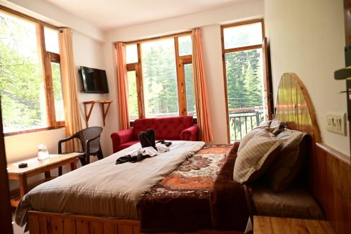 Postel nebo postele na pokoji v ubytování Rest N Ramble - Manali