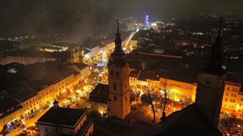 an aerial view of a city at night at Penzión Grand, Self Check-In, free private parking in Banská Bystrica