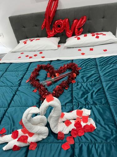 a bed with two swans made to look like hearts at Dodi's house in Pozzuoli