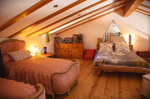 Postel nebo postele na pokoji v ubytování maison de la salamandre