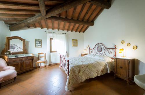 Un pat sau paturi într-o cameră la Agriturismo Verde Oliva