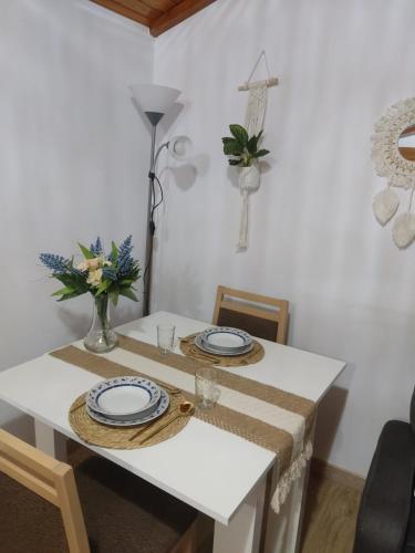 a white table with two plates on top of it at Buen Camino Arzua in Arzúa