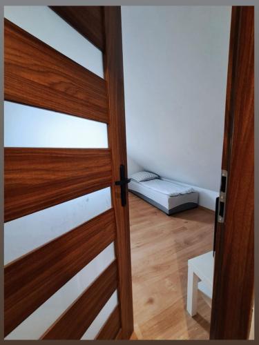 Ένα ή περισσότερα κρεβάτια σε δωμάτιο στο Apartament Ideos 7 osobowy