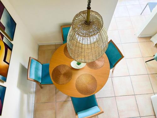 an overhead view of a table with chairs and a basket at Discover The Best Area of Coronado with Pool in Chame