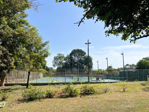 a tennis court in a park with a tennis court at Discover The Best Area of Coronado with Pool in Chame