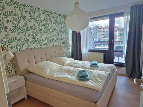 Postel nebo postele na pokoji v ubytování 5 DTV Sterne Ferienwohnung am See Stella