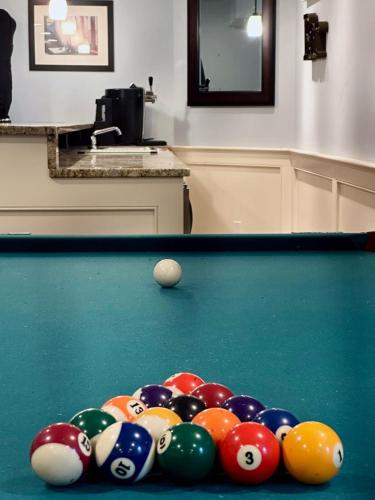 a group of billiard balls on a pool table at Southampton Family Estate in Southampton