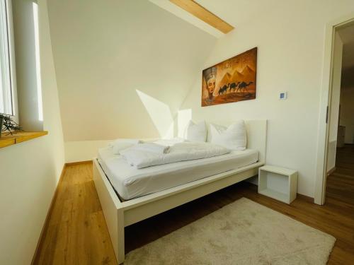 Ένα ή περισσότερα κρεβάτια σε δωμάτιο στο Dill Apartment Pleinfeld am Brombachsee III
