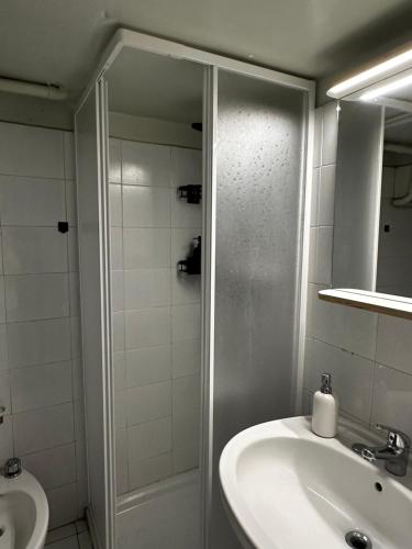 a bathroom with a shower and a sink at Come a casa in Trani