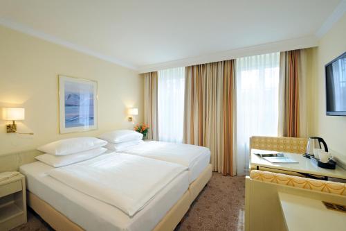TV a/nebo společenská místnost v ubytování Hotel Scherer