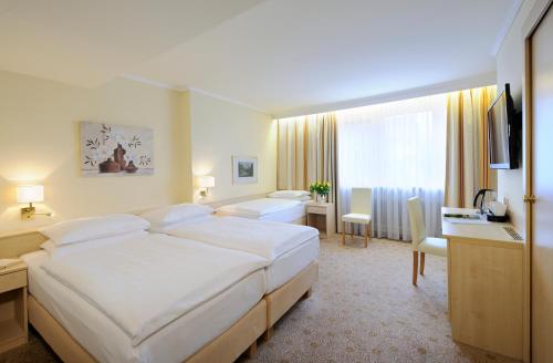 Postel nebo postele na pokoji v ubytování Hotel Scherer