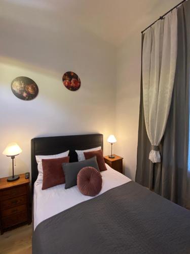 Ένα ή περισσότερα κρεβάτια σε δωμάτιο στο Krakow Apartments & Rooms