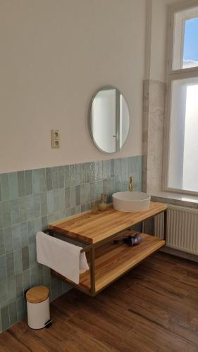 a bathroom with a sink and a mirror at Pension Zámek Rudník in Rudník