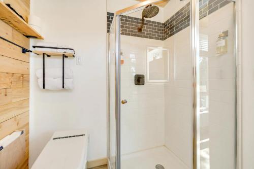 a bathroom with a shower and a toilet at Modern Hill Country Container in Spicewood