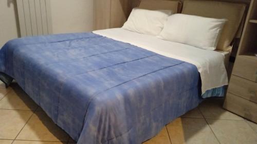 Postel nebo postele na pokoji v ubytování B&B Resort Palazzo Pirozzi