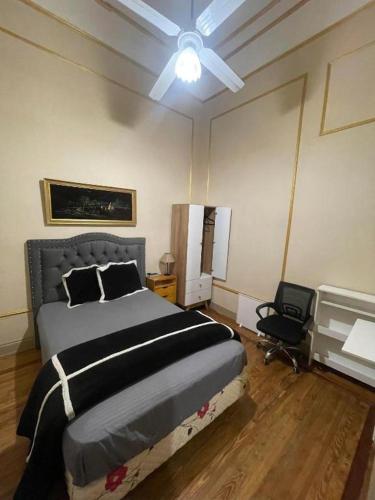a bedroom with a bed and a ceiling fan at Beautiful stay in Abasto-Recoleta-R-M in Buenos Aires