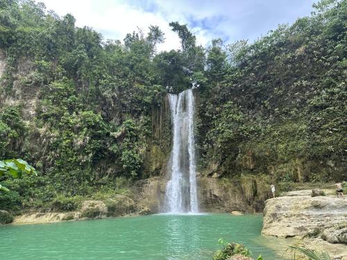 a waterfall in the middle of a pool of water at Casa Bella in Baclayon