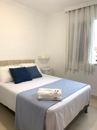 En eller flere senge i et værelse på Apartamento SN Orlando Dantas