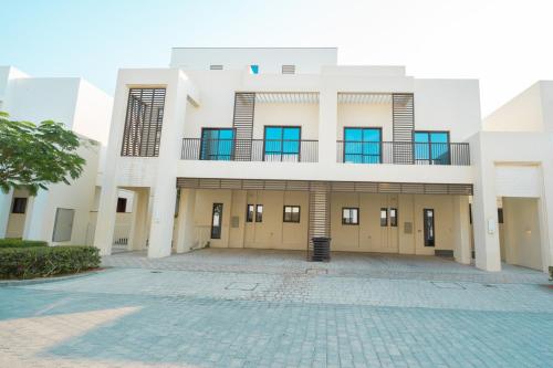 an exterior view of a building with a courtyard at White Villa By the Sea in Fujairah