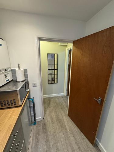 Kuchyň nebo kuchyňský kout v ubytování A cosy apartment