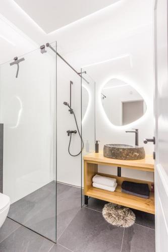 a bathroom with a sink and a mirror at Charming A&S Pohorje Apartments in Pohorje