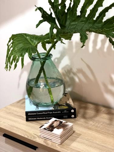 a glass vase sitting on top of a book at Studio 885 in North Shields