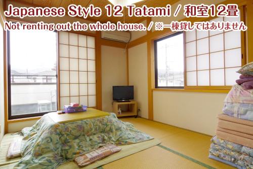a hospital room with a bed and a tv at NIKKO stay house ARAI - Vacation STAY 14994v in Nikko