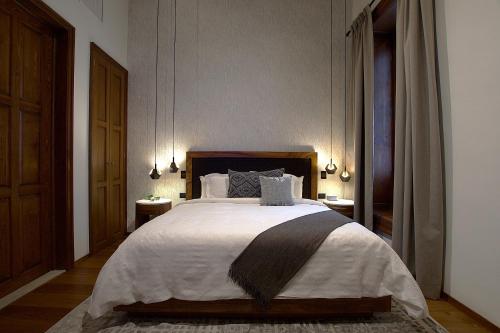 Ένα ή περισσότερα κρεβάτια σε δωμάτιο στο Nueve 25 Hotel Boutique