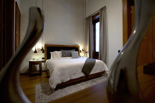 Ένα ή περισσότερα κρεβάτια σε δωμάτιο στο Nueve 25 Hotel Boutique