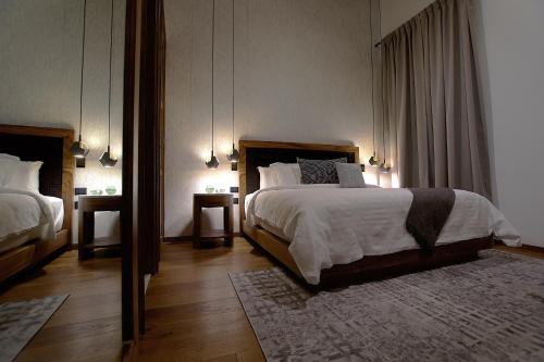 Ένα ή περισσότερα κρεβάτια σε δωμάτιο στο Nueve 25 Hotel Boutique
