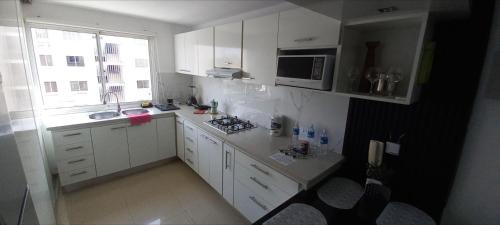 Kuchyň nebo kuchyňský kout v ubytování Apartamento ideal y comodo