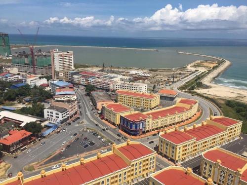 an aerial view of a city next to the ocean at Aisywara Homestay Kuala Terengganu in Kuala Terengganu