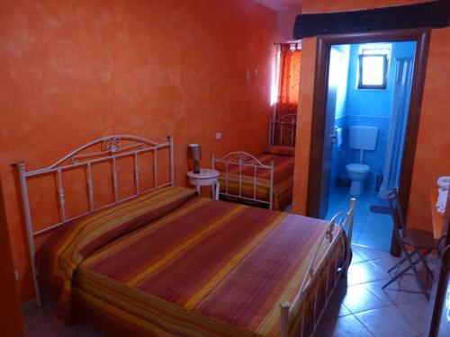 a bedroom with a bed in a room at B&B Figli Dei Fiori in Realmonte